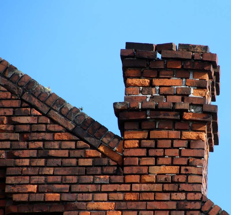 Damaged chimney on an Margate home showing cracks and missing mortar